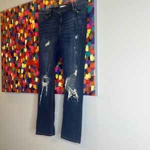 Distressed blue jeans